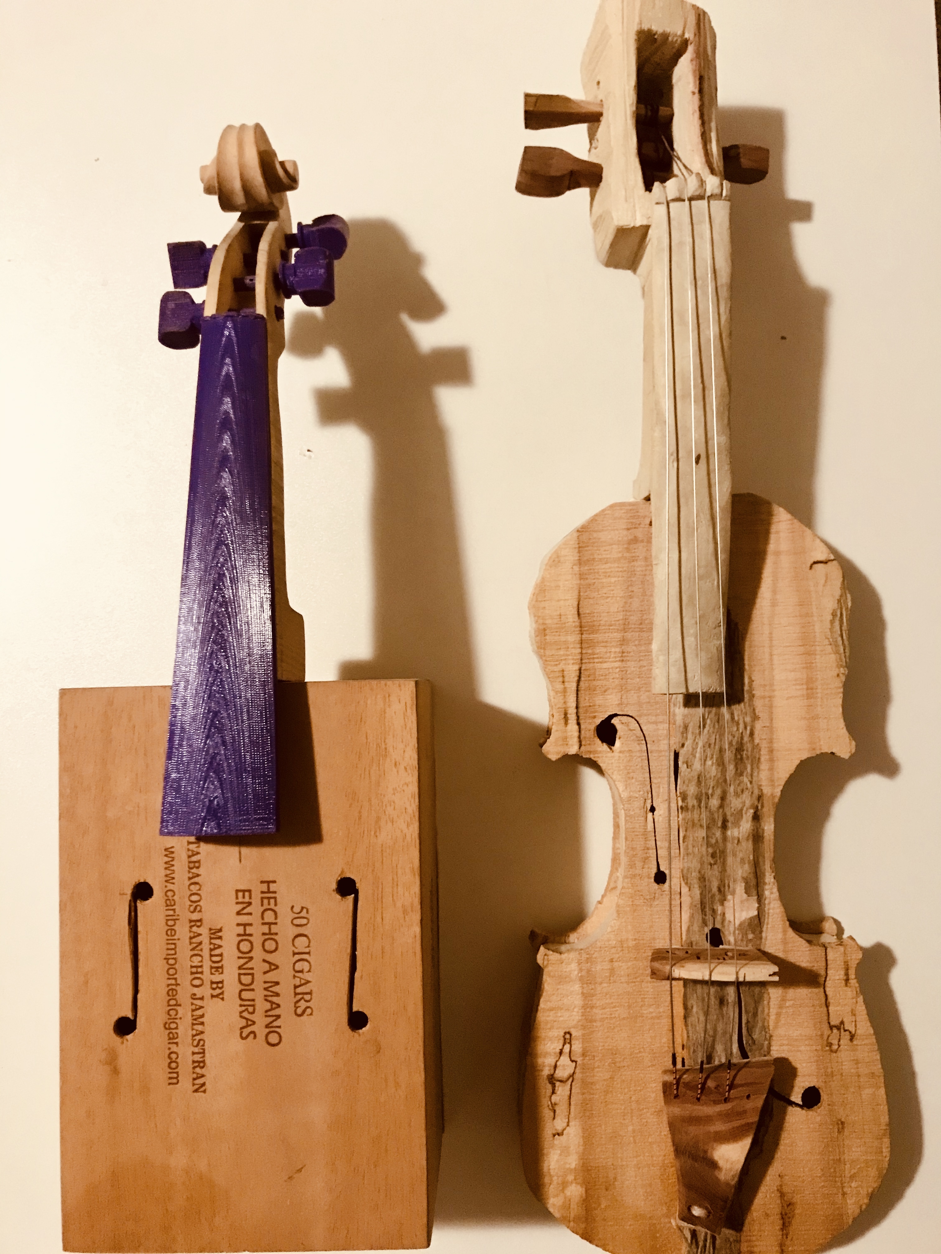 2 Violins - one from a cigar box and one from driftwood and scraps